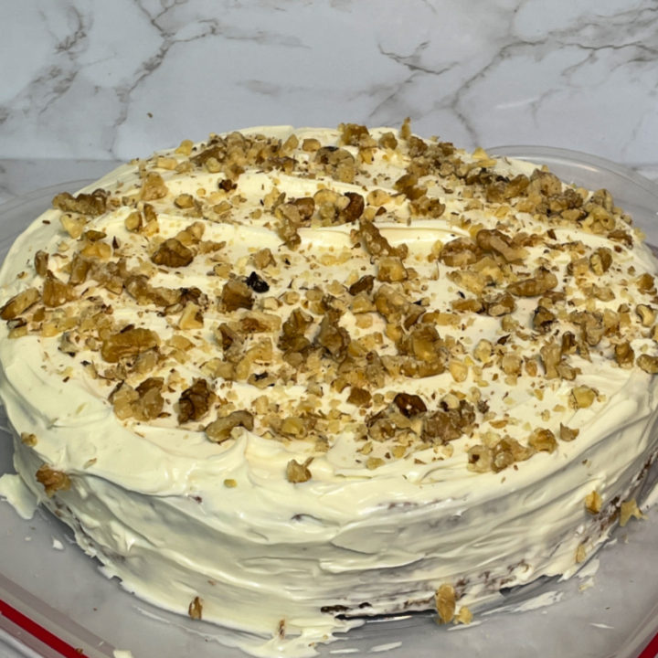 Gluten Free Carrot Cake topped with walnuts