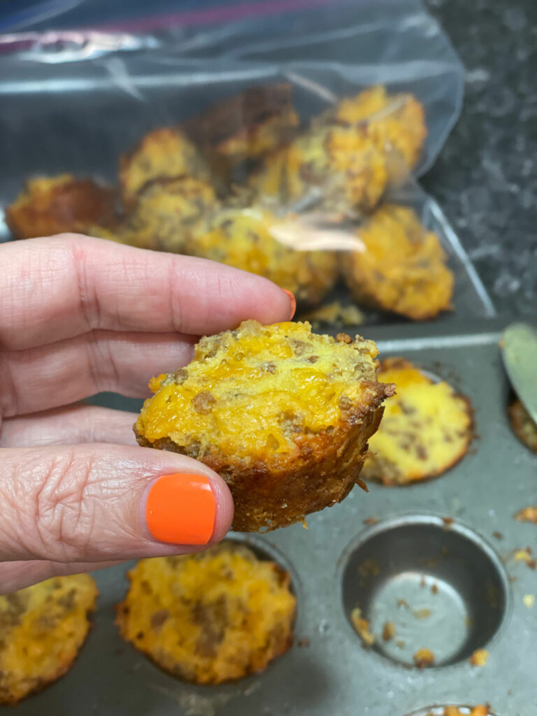 Keto Sausage and Cheese Mini Muffin hold one between fingers