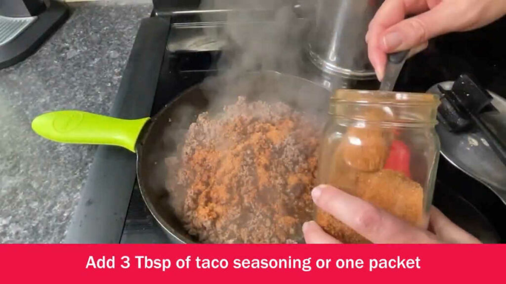Keto Taco Pie adding taco seasoning