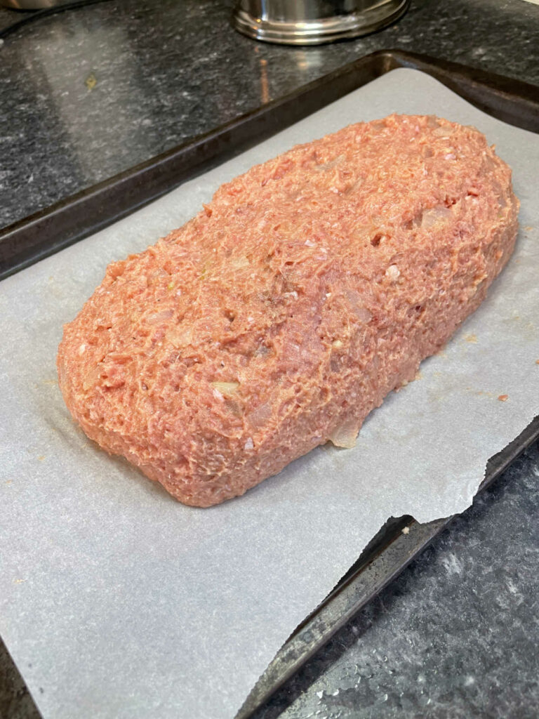 Keto Beef and Turkey Meatloaf shaped into a loaf