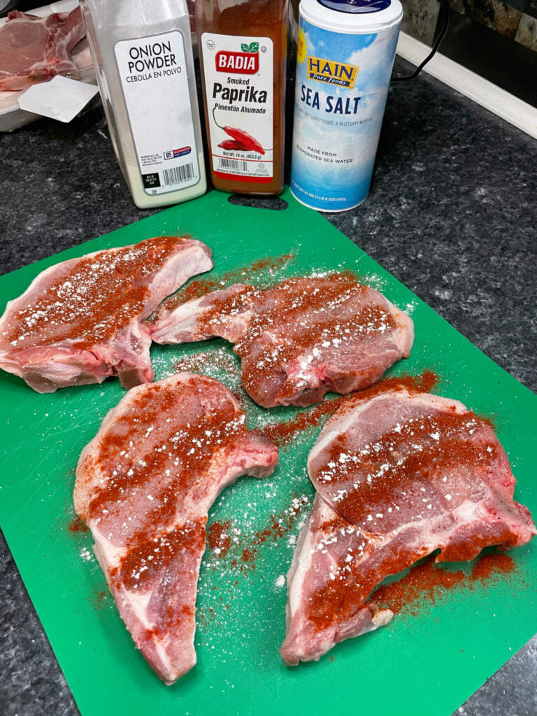 Skillet Fried Pork Chops adding seasoning